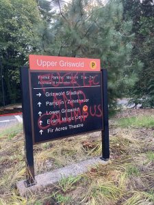 Lewis and Clark College sign has been vandalized with spray paint. The paint reads: Fuck L+C and Columbus