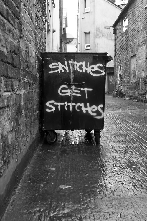 dumpster graff"snitches get stitches"